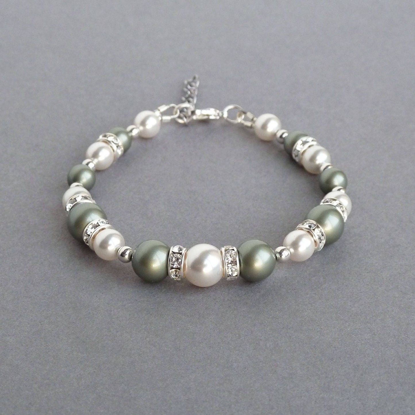 Sage green and white bracelet made with pearls and bands of crystals