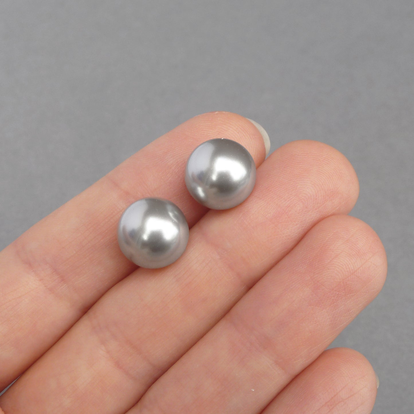 Large light grey stud earrings