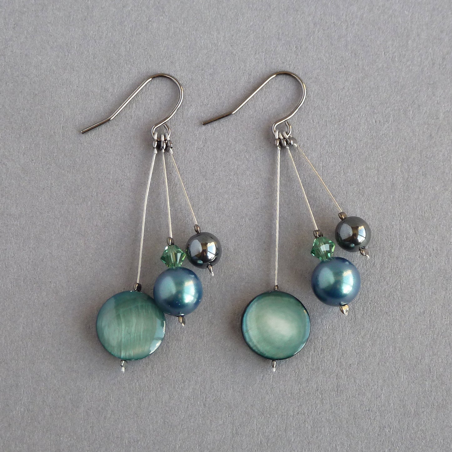 Long dark green dangle earrings