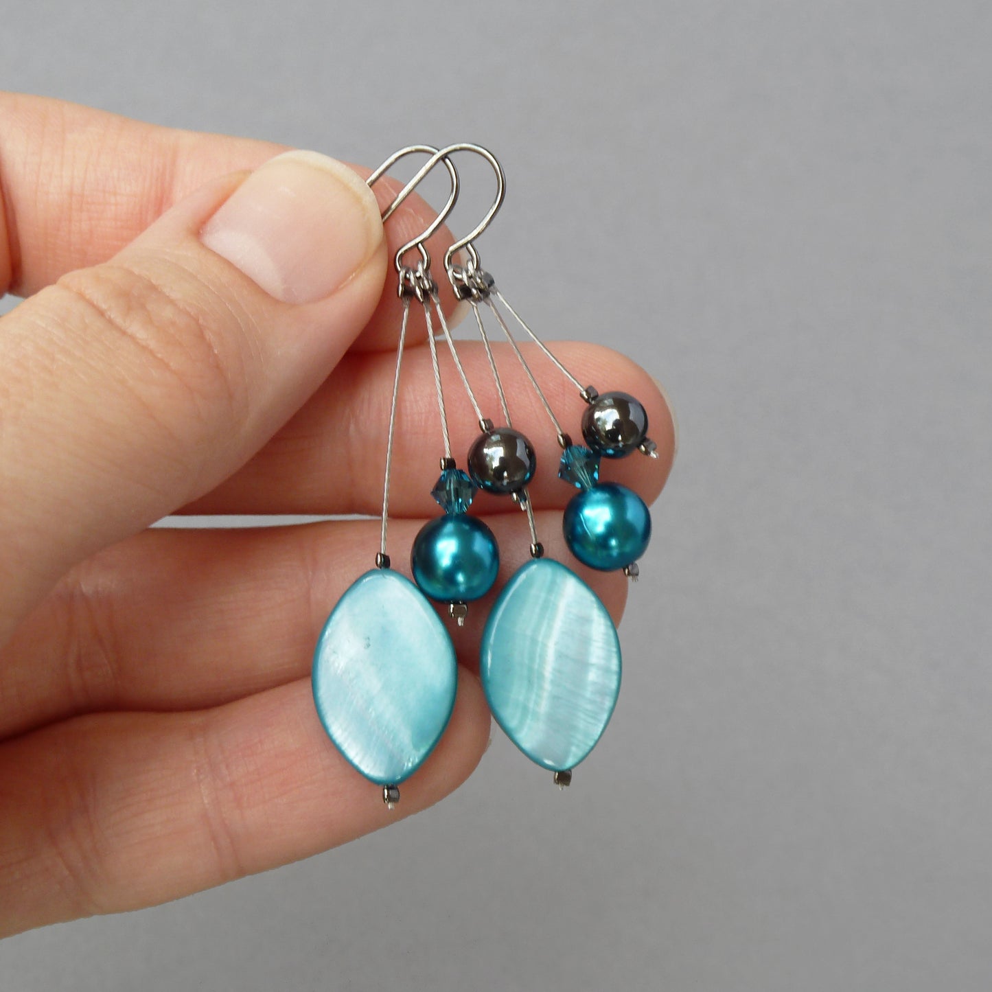 Long petrol blue earrings
