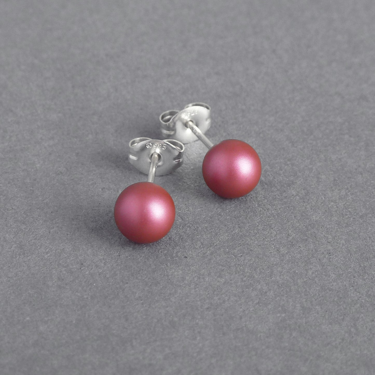Small dark pink pearl studs