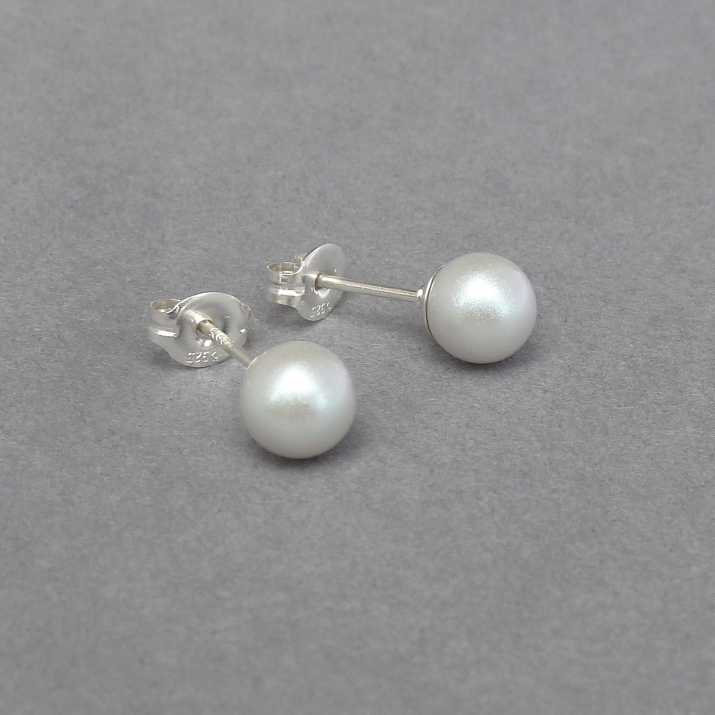 Small pearlescent stud earrings