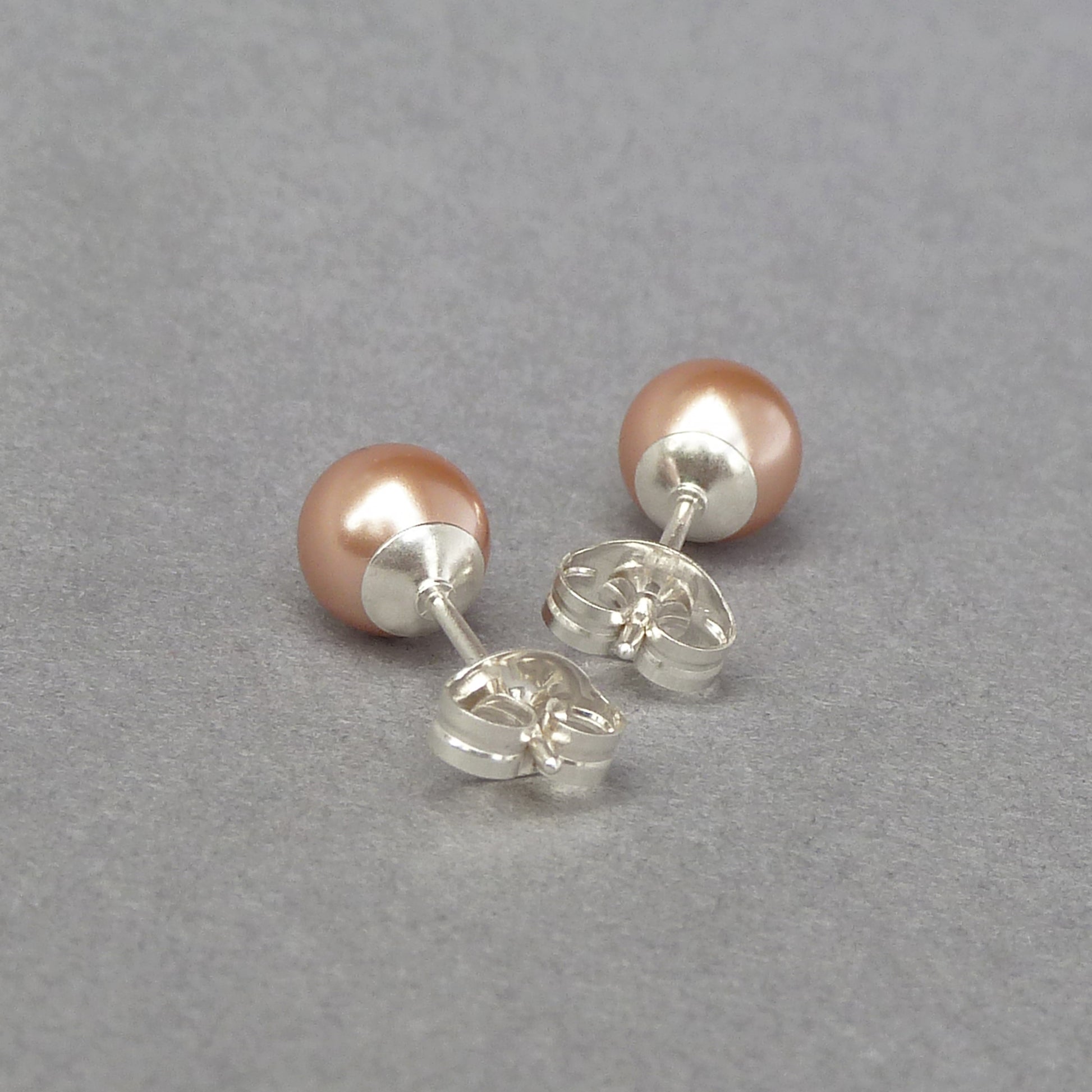 Small rose gold pearl studs