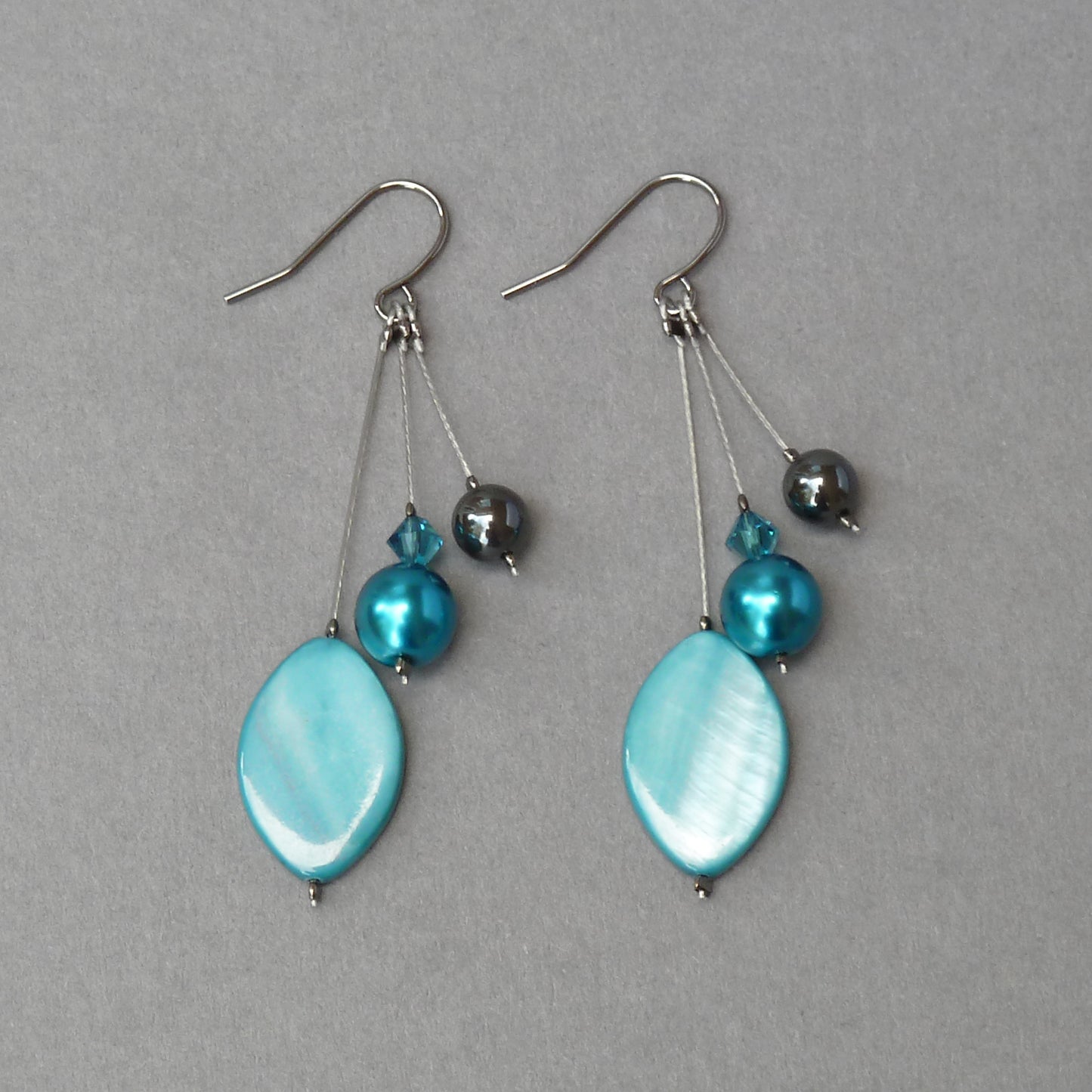 Teal three strand earrings