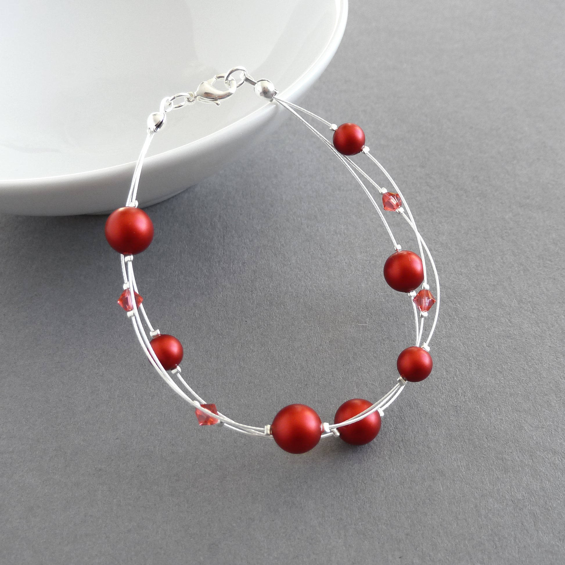Bright red floating pearl bracelet