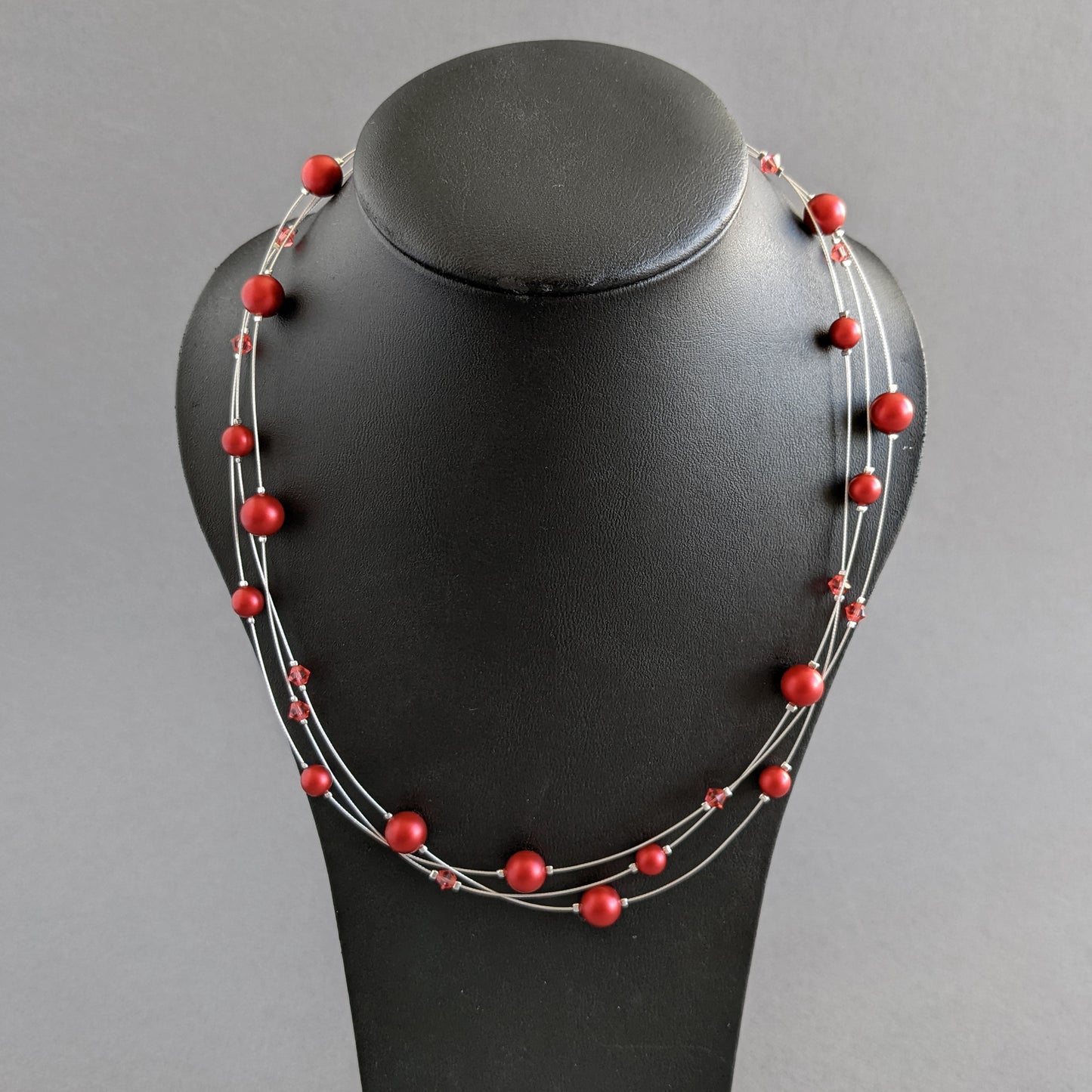 Bright red floating pearl necklace