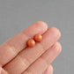 Round coral orange pearl studs