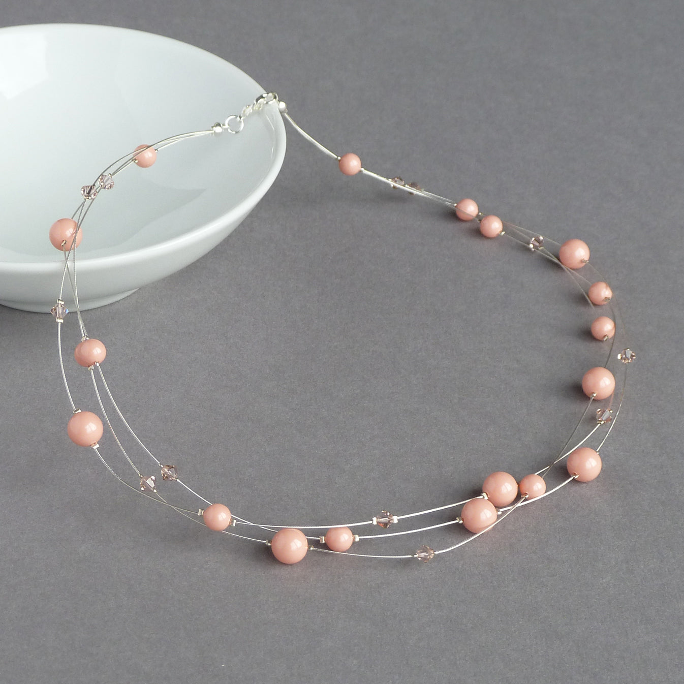 Coral pink floating pearl necklace