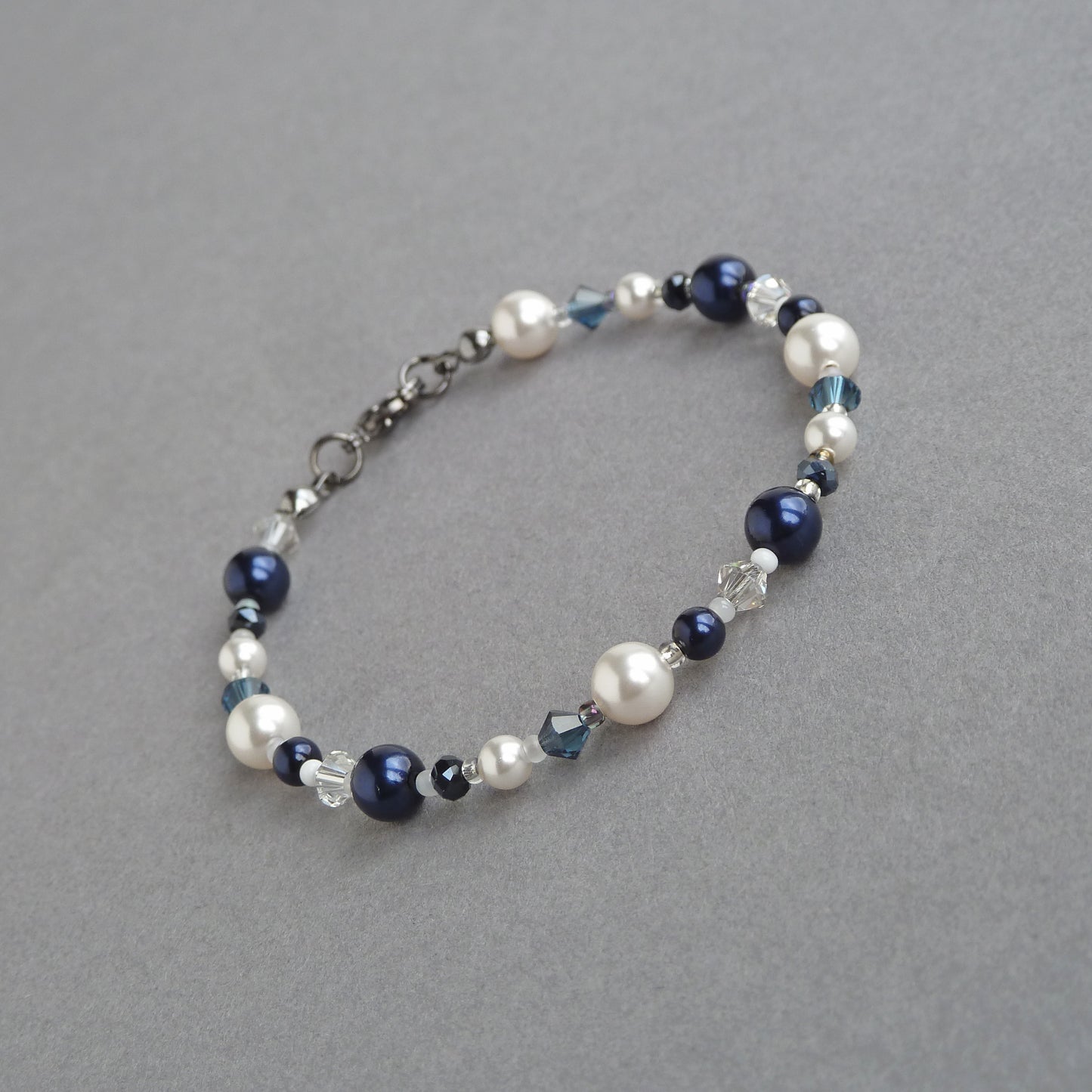 Dainty navy pearl bracelet made with crystals and pearls.