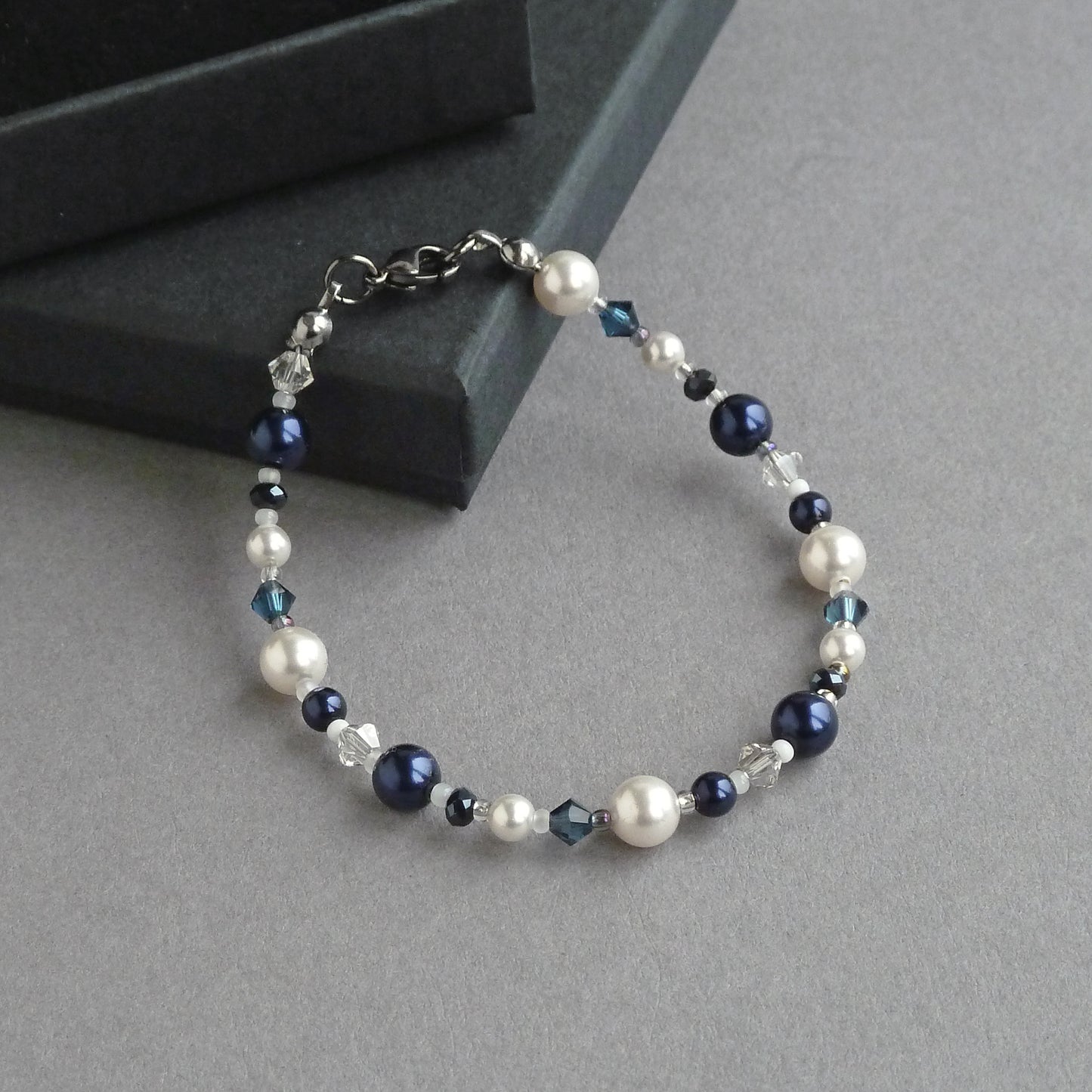 Dark blue and white beaded pearl bracelets.