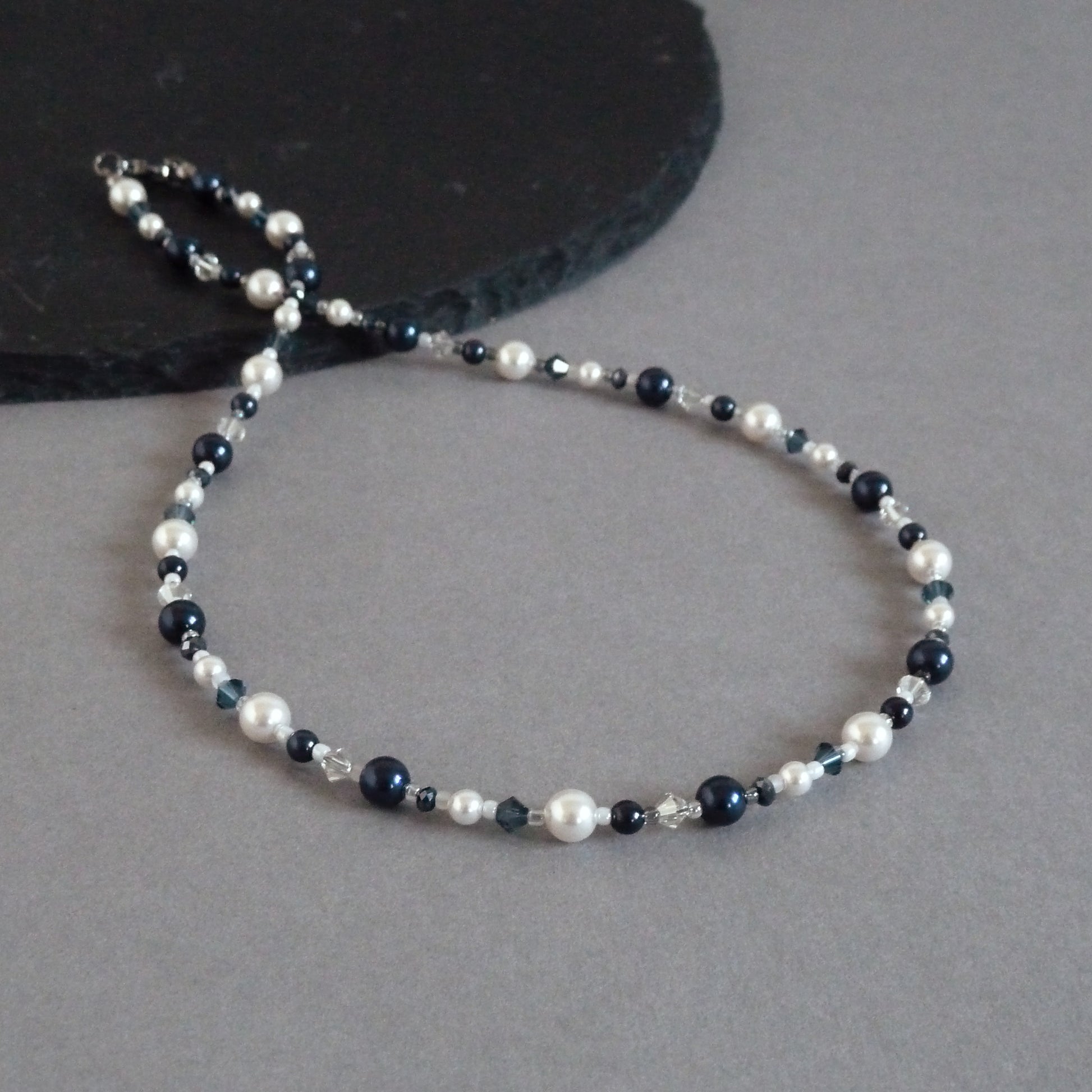 Dark blue pearl and crystal necklace made with white and navy pearls