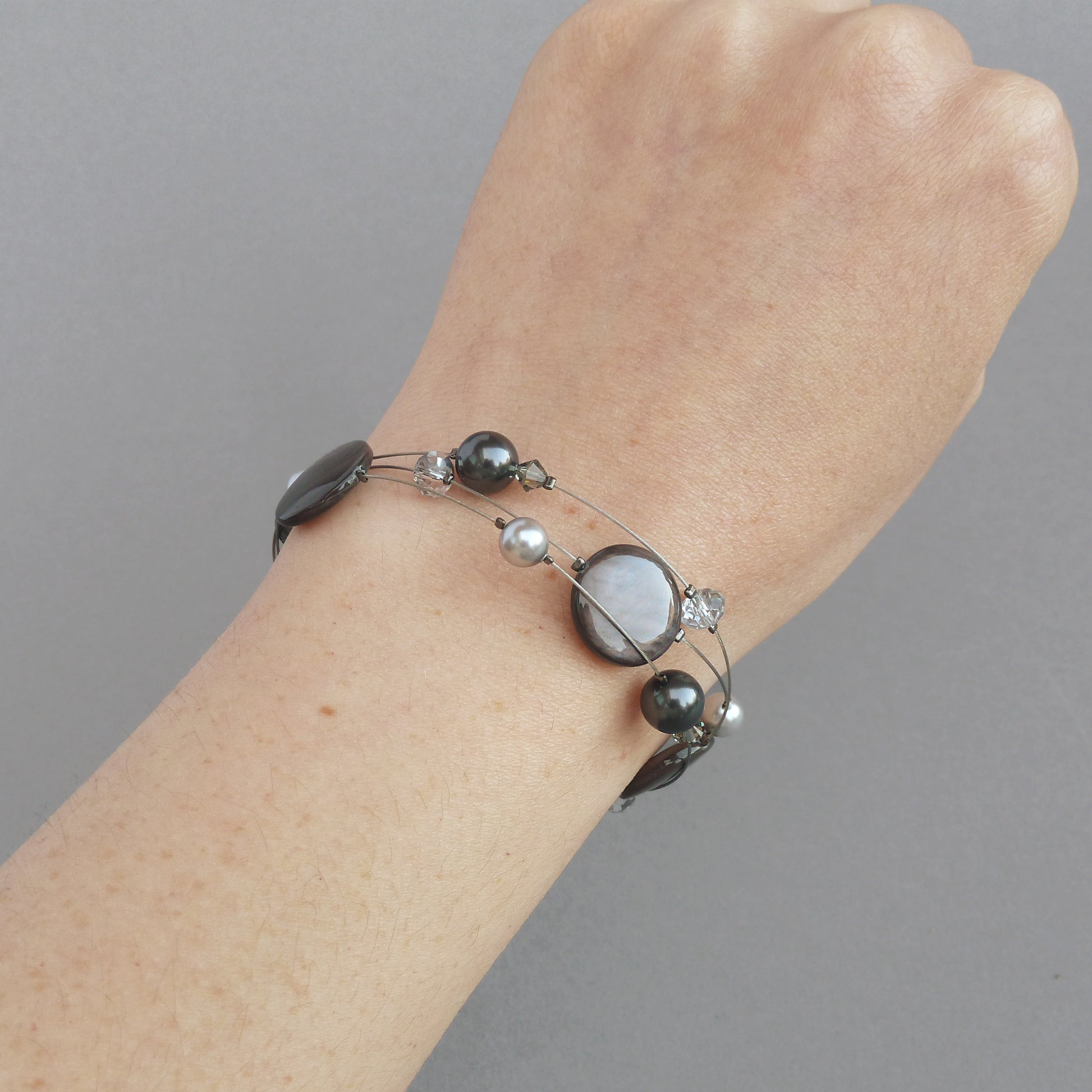Dark grey pearl three strand bracelet