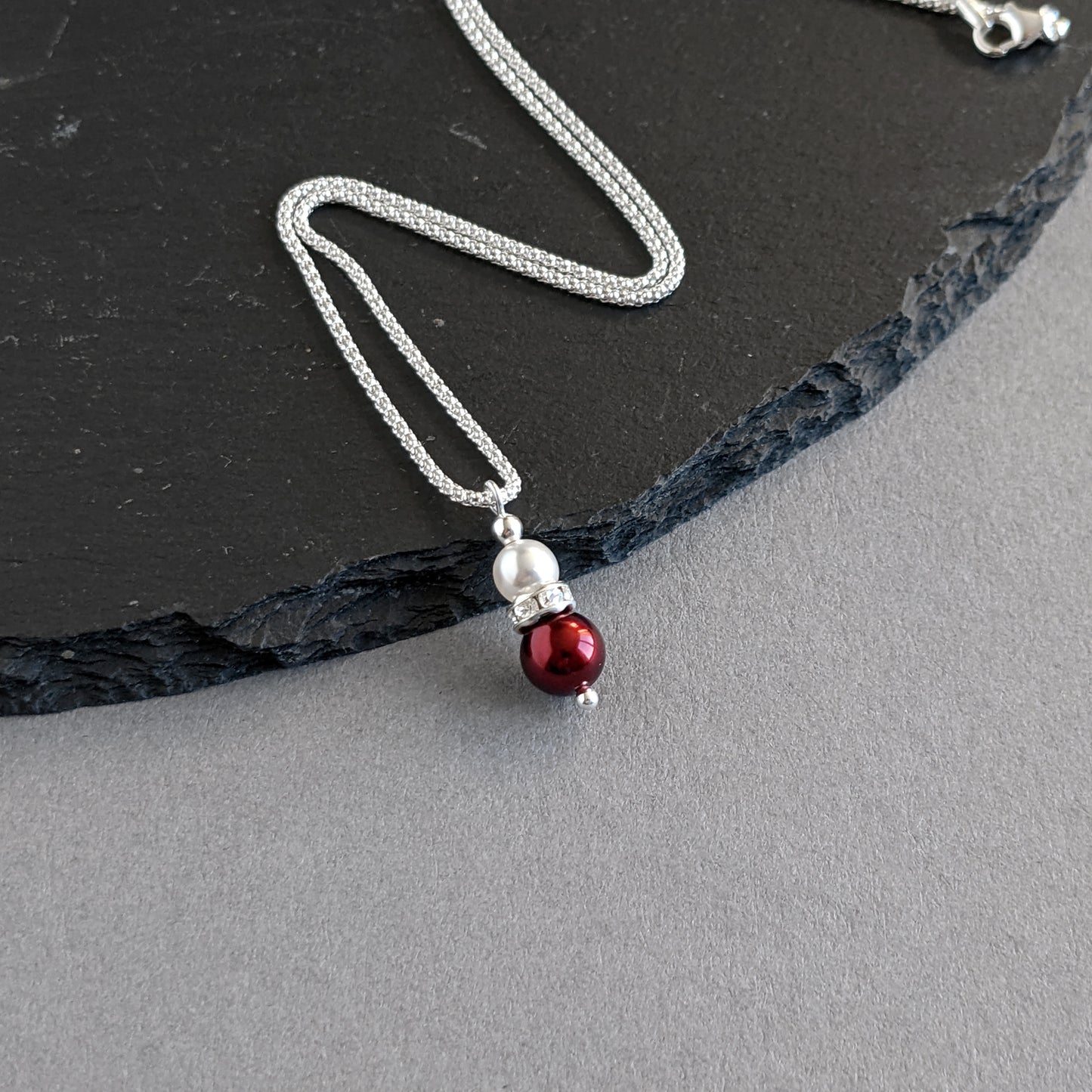 Dark red pearl pendant necklace