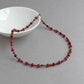 Dark red pearl necklace