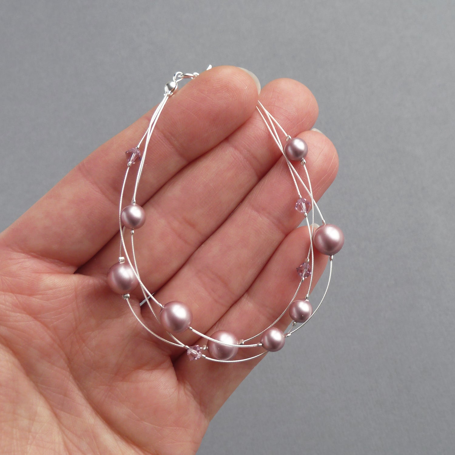 Dusky pink pearl three strand bracelet