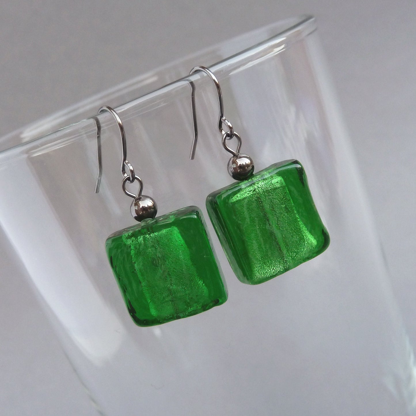 Green glass dangle earrings