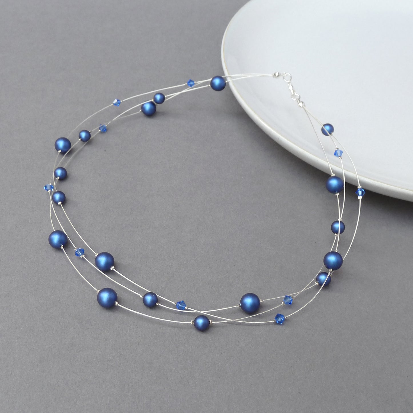 Iridescent dark blue pearl necklace