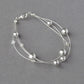 Light grey floating pearl bracelet