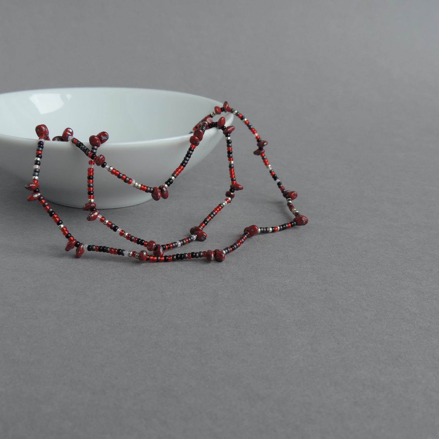 Long red beaded necklace