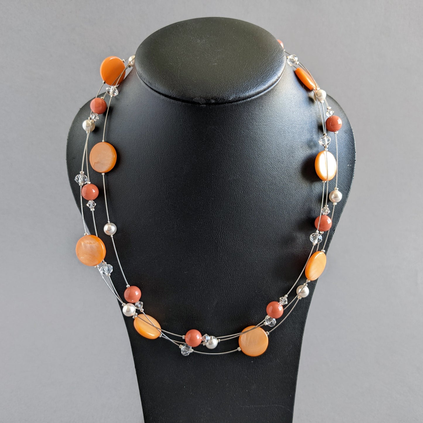 Orange floating pearl necklaces