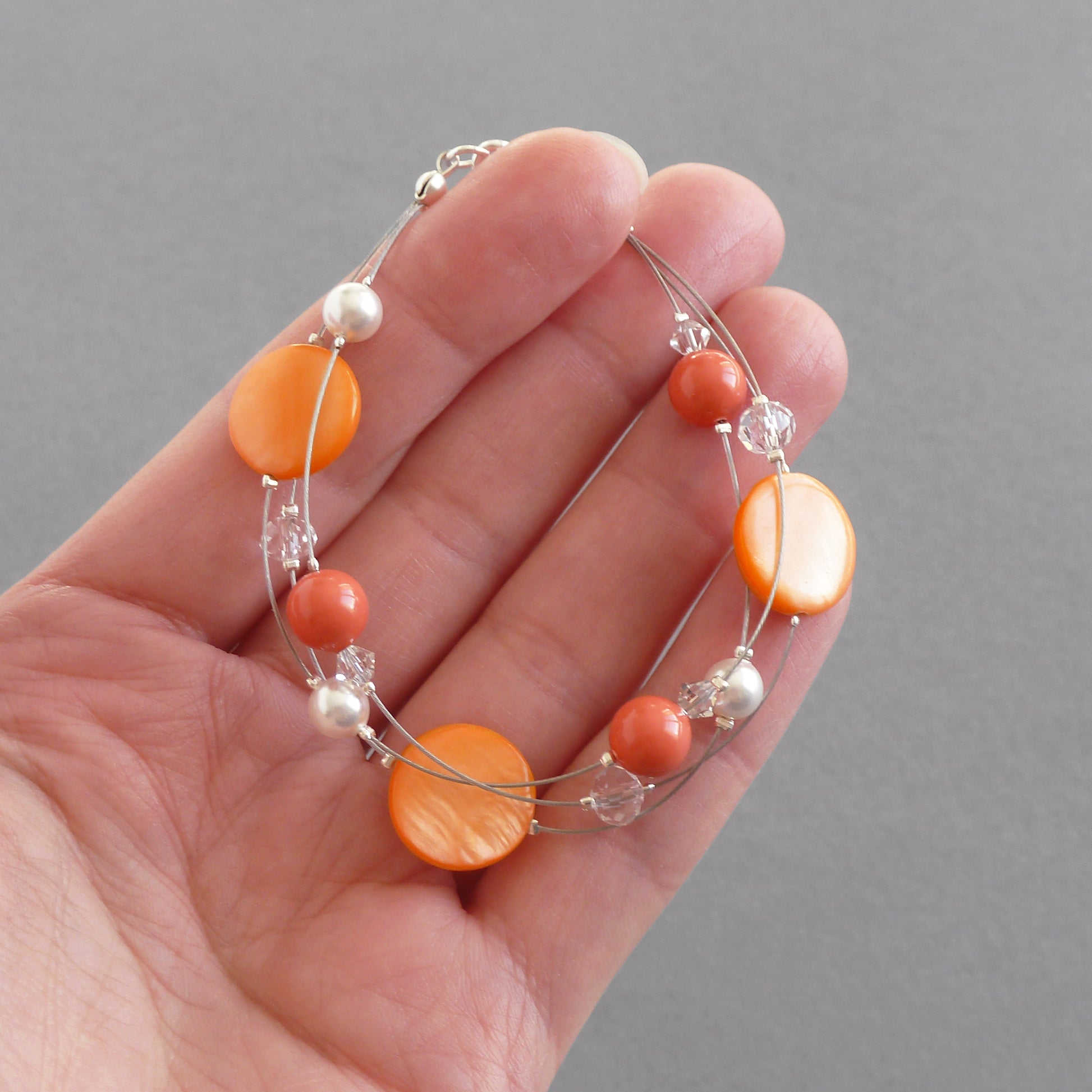 Orange three strand bracelet