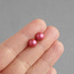 Pink glass pearl stud earrings