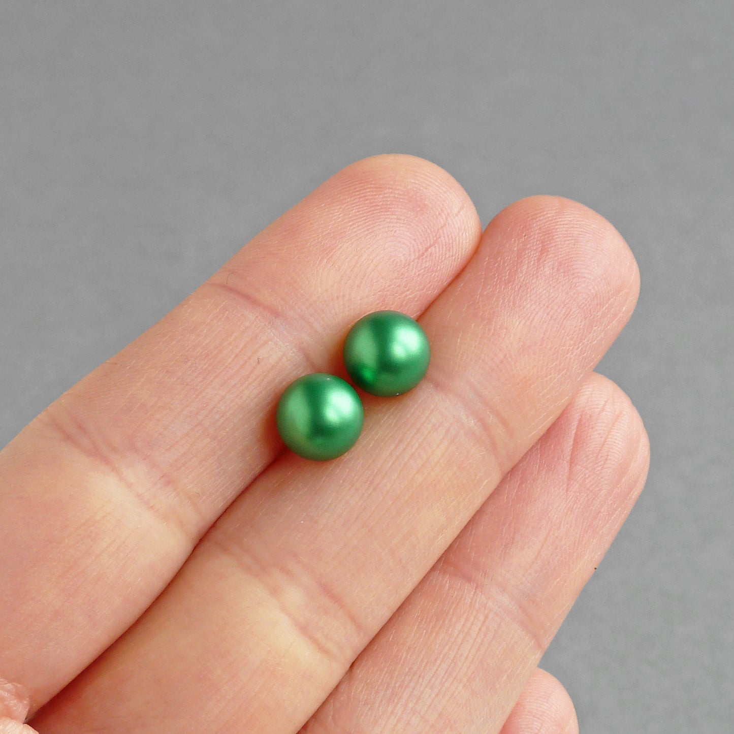 Round green pearl earrings