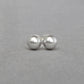 Round light grey pearl stud earrings