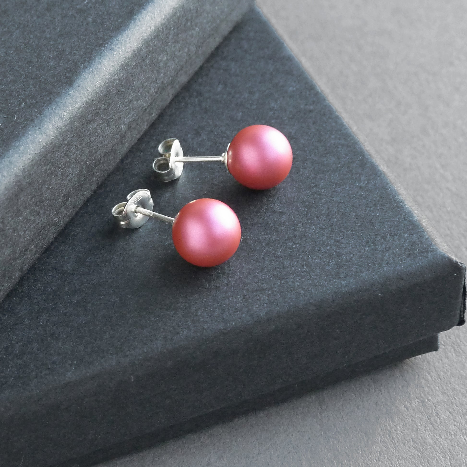 Round pink stud earrings