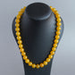 Single strand chunky yellow necklace