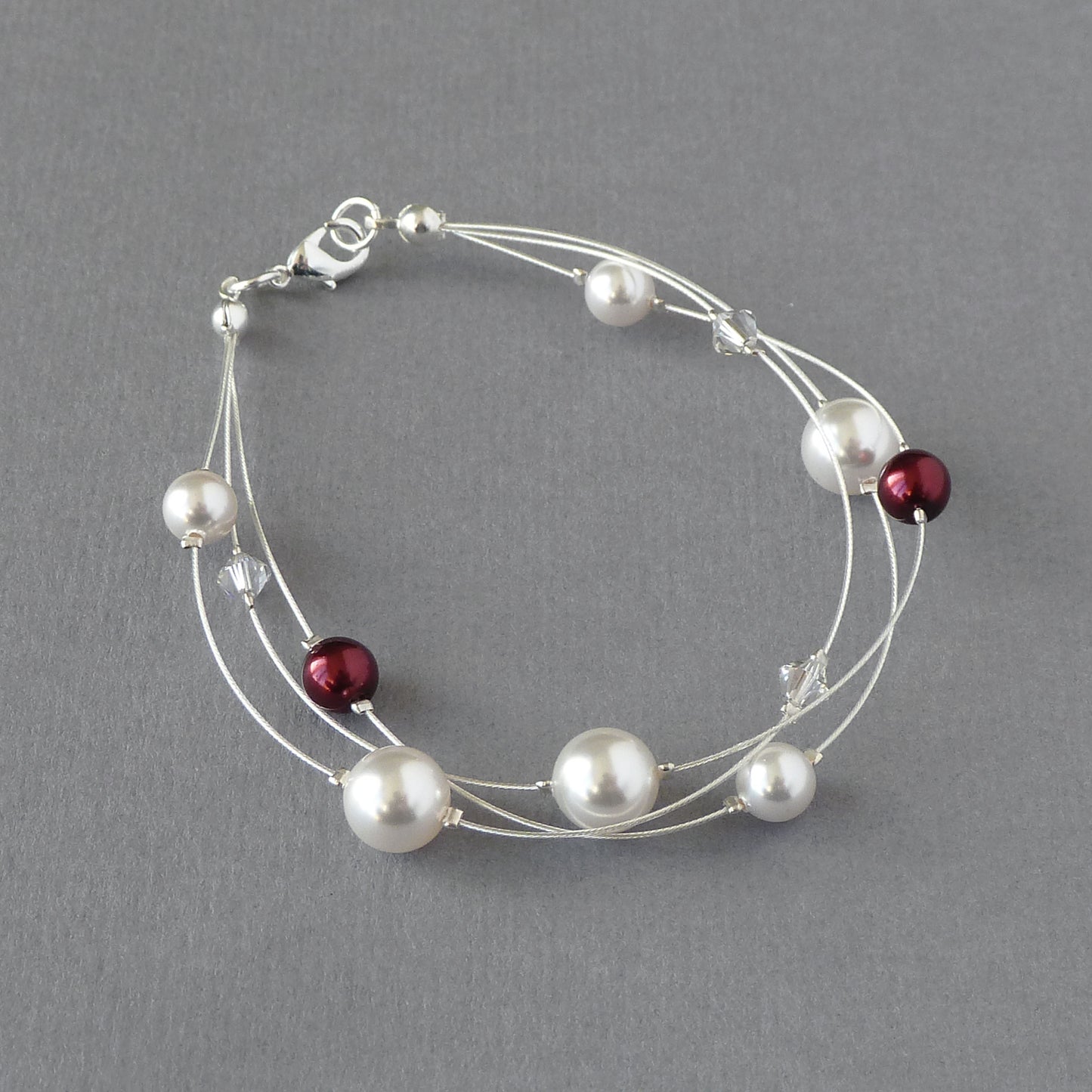 White and dark red floating pearl bracelet