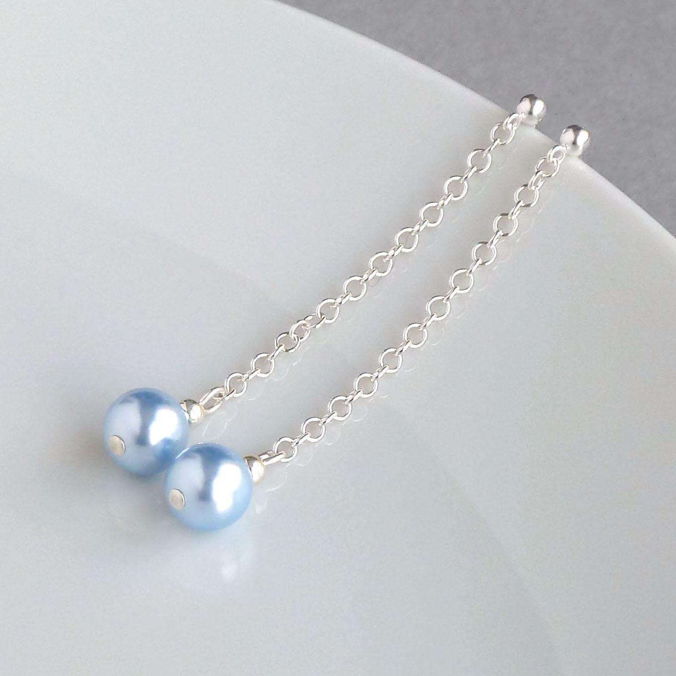 Baby blue pearl dangle earrings