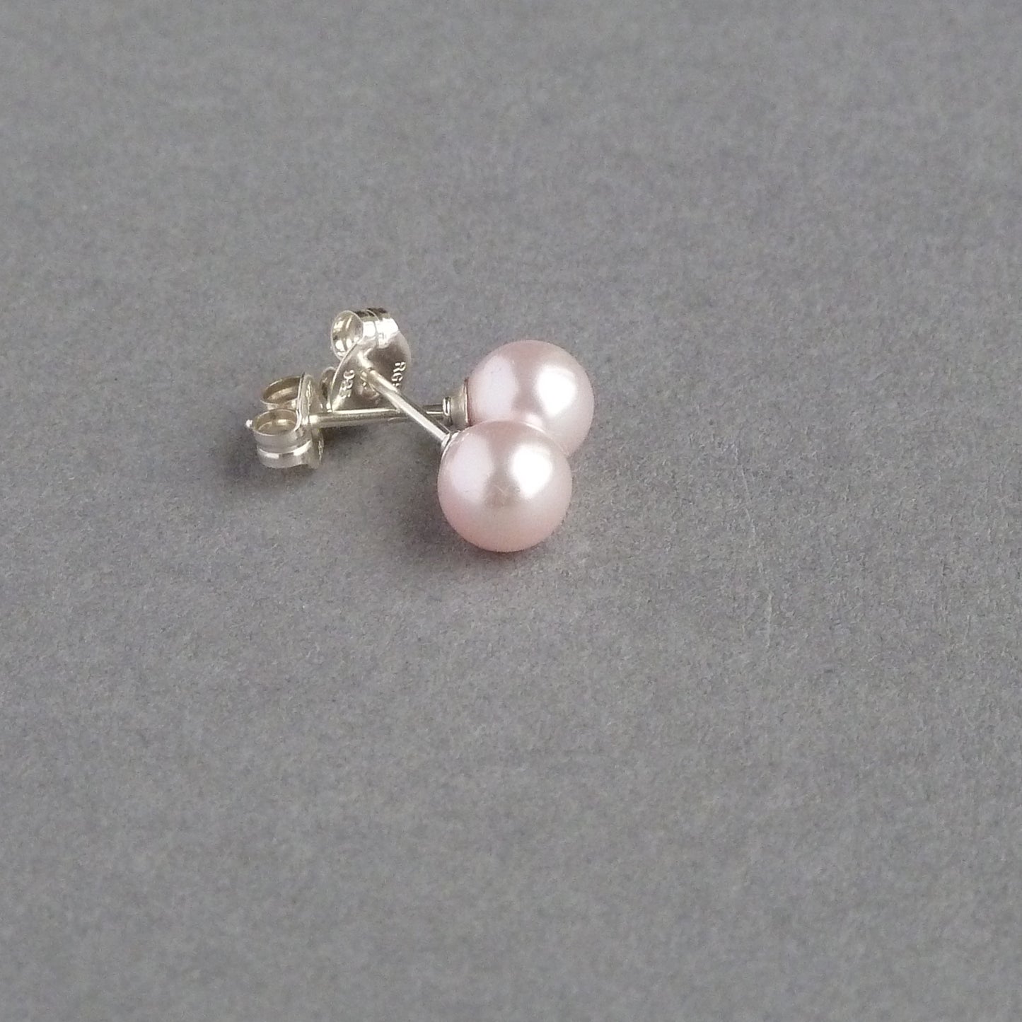 Baby pink pearl stud earrings