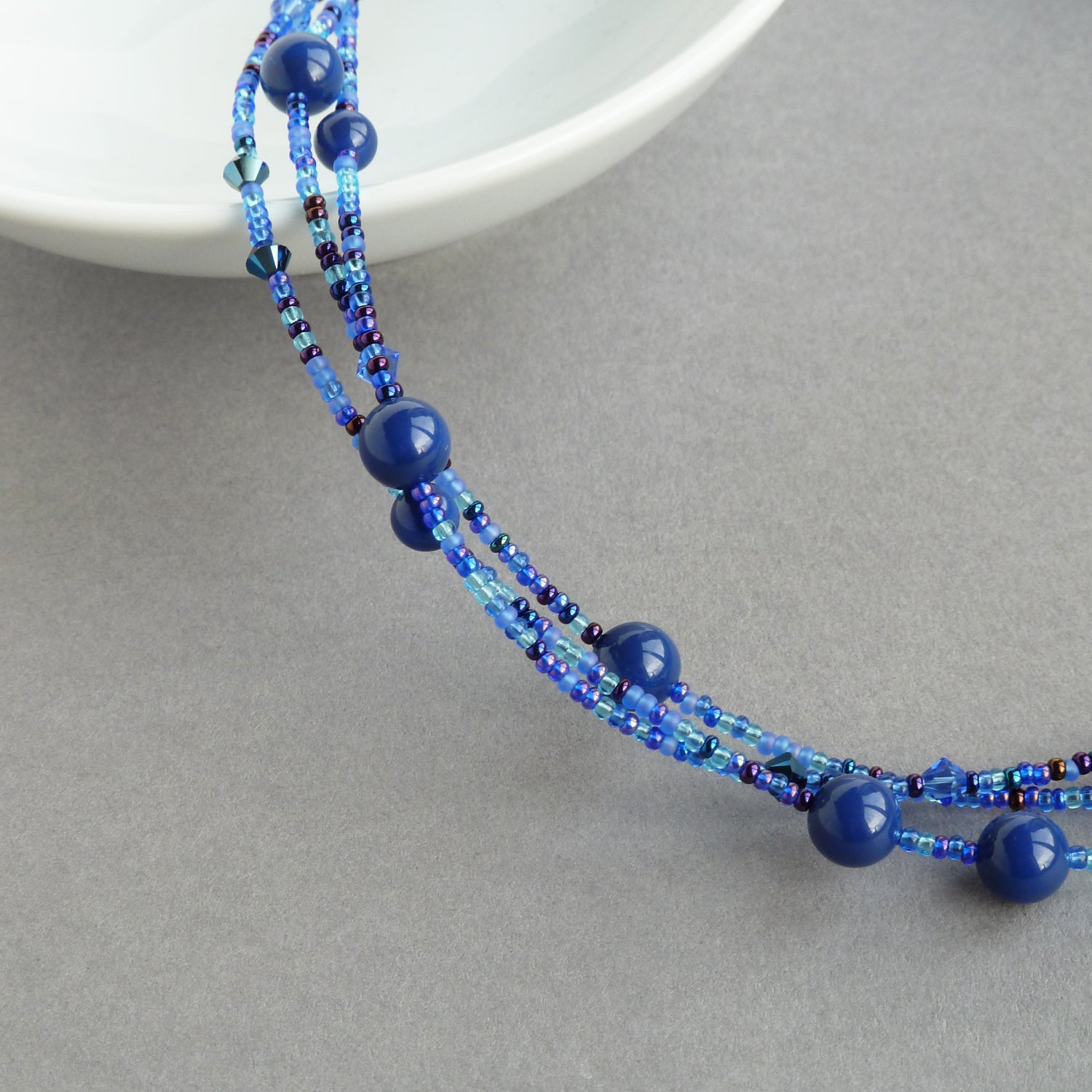 Necklace - plaited cobalt blue pearls and deals glass