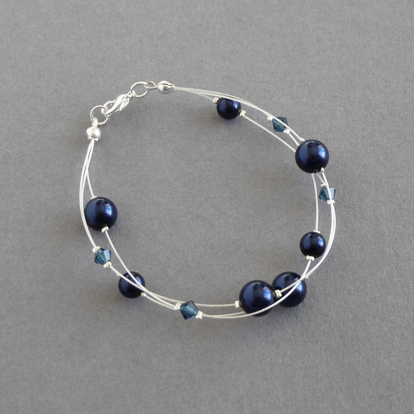 Dainty navy pearl three strand bracelet