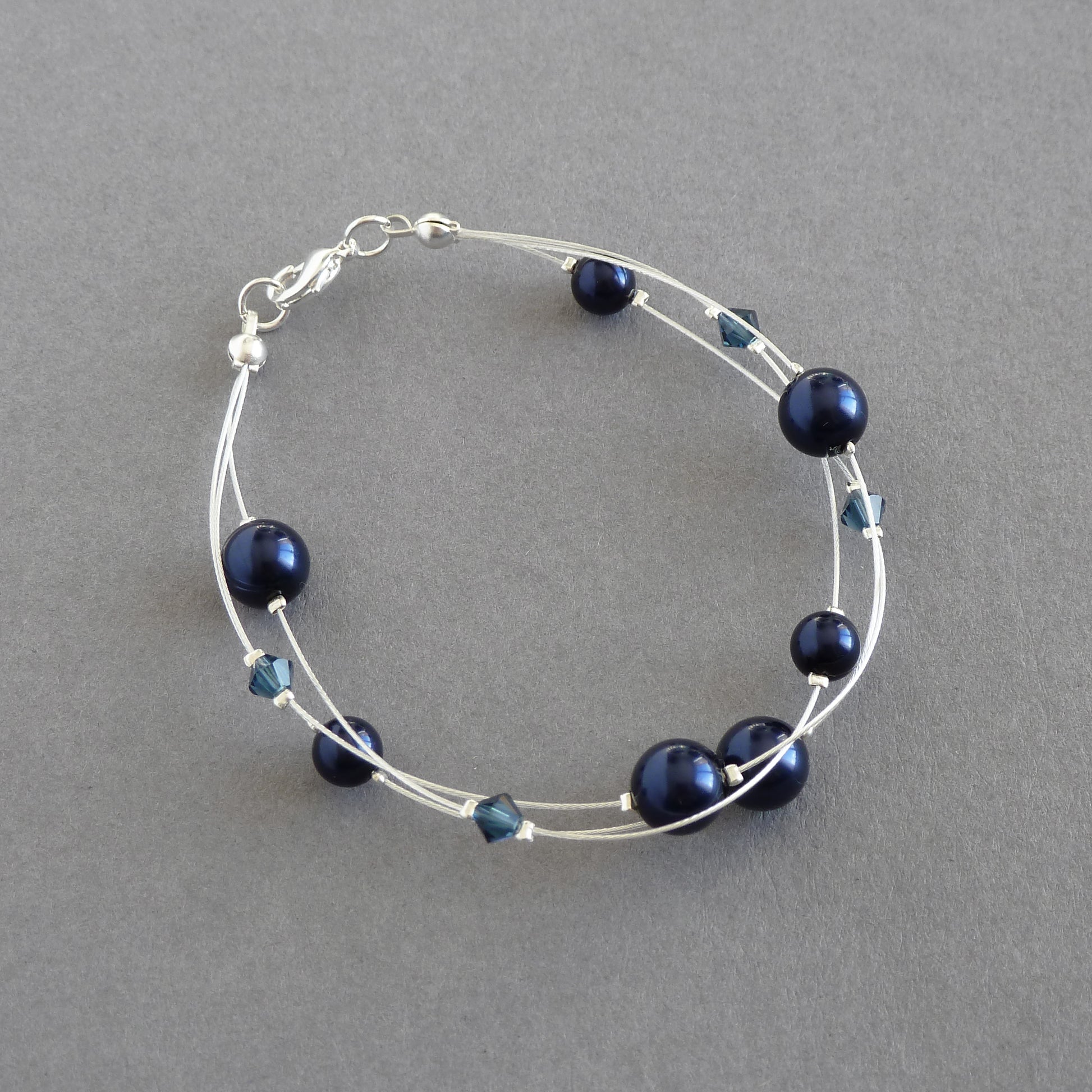 Dainty navy pearl three strand bracelet
