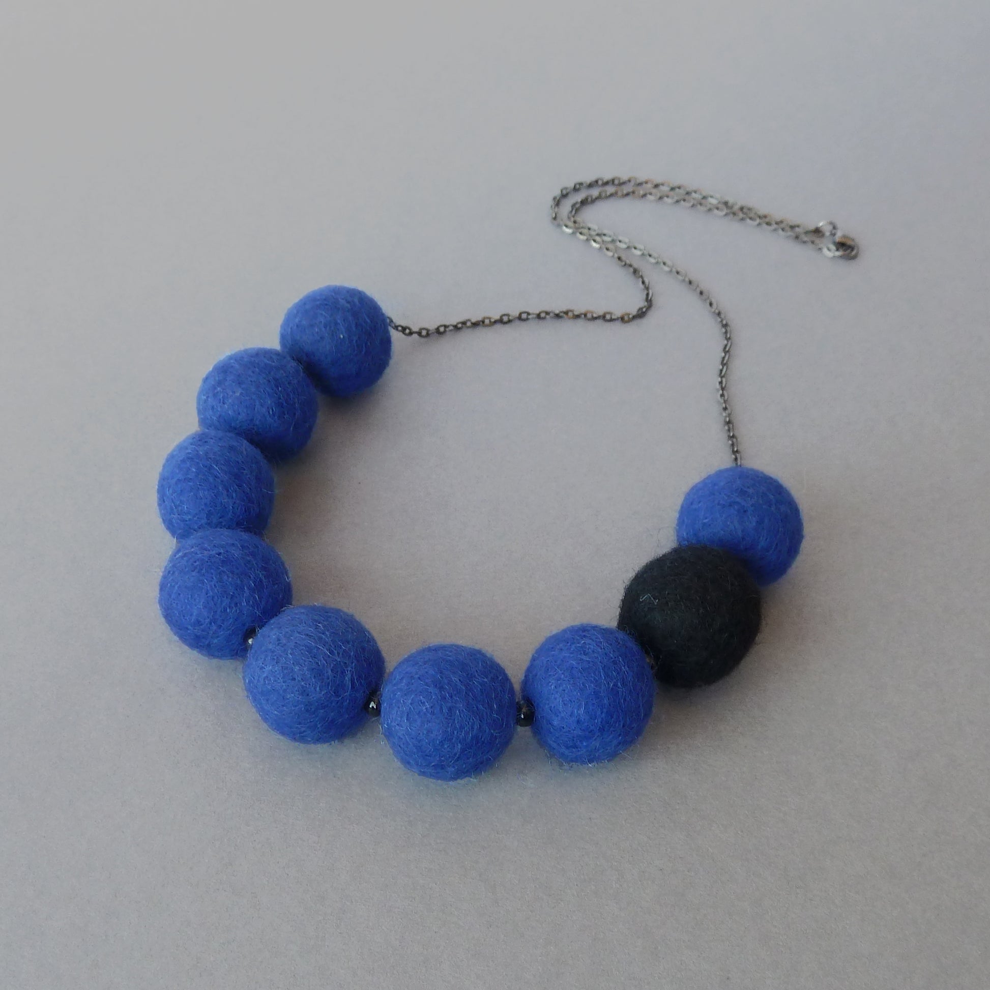 Dark blue felt ball necklace