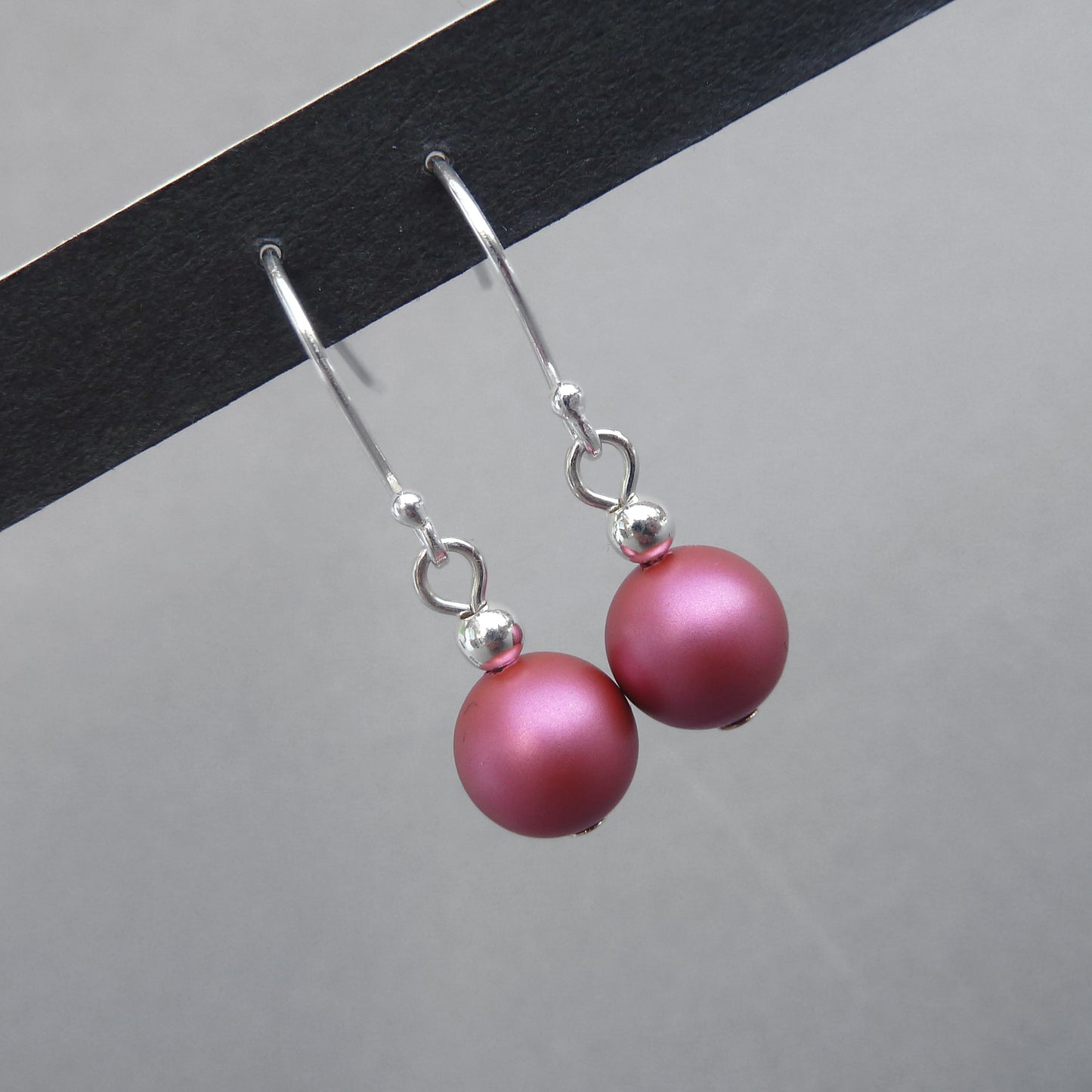 Dark pink pearl drop earrings