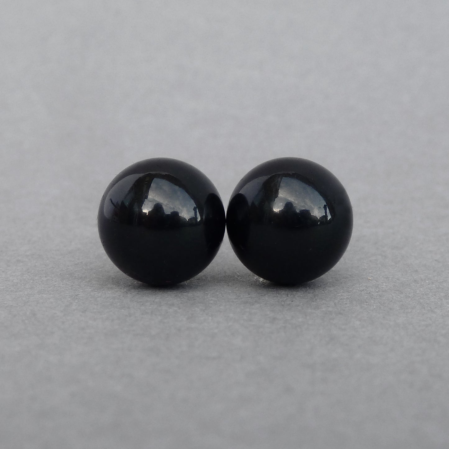 Large jet black stud earrings