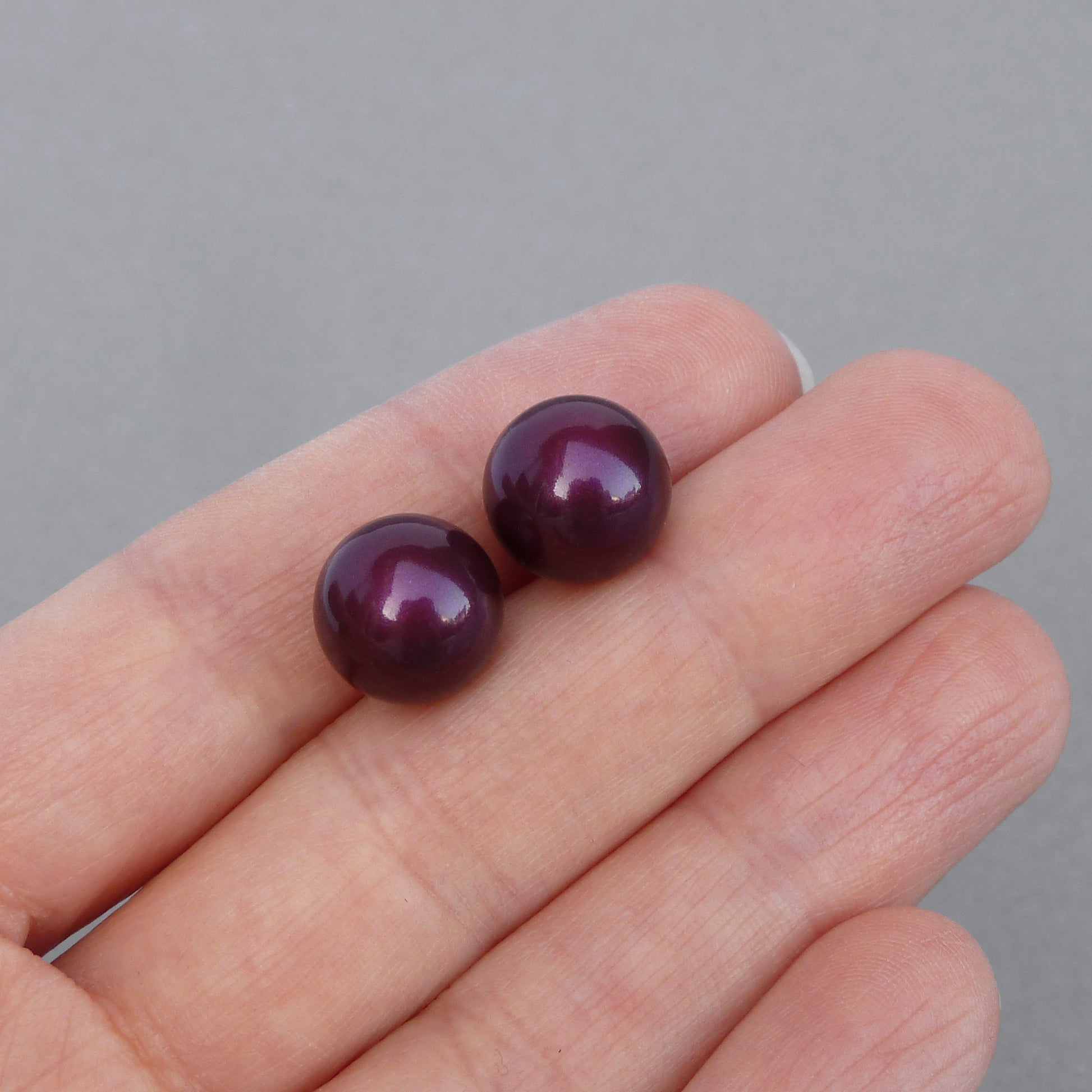 Large plum stud earrings