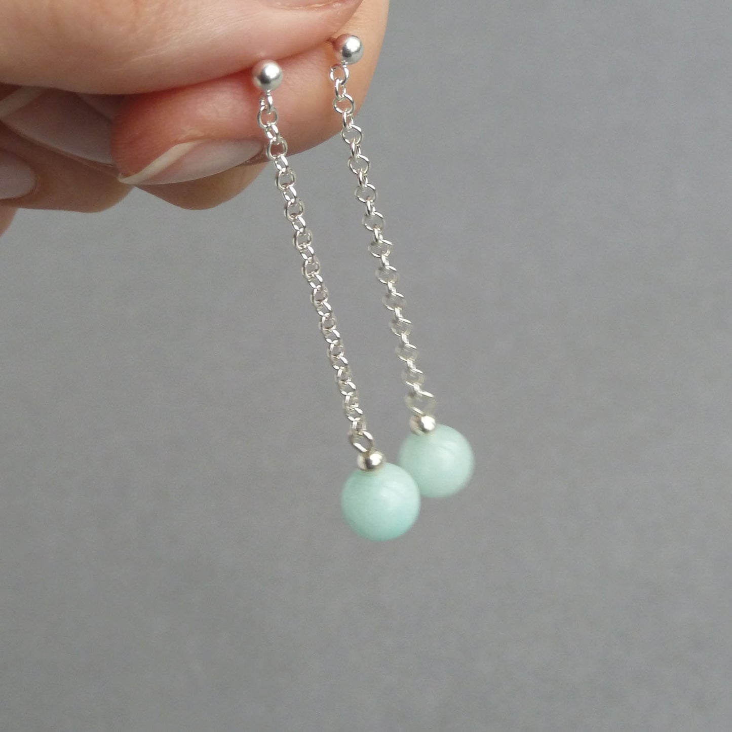 Long mint green dangle earrings