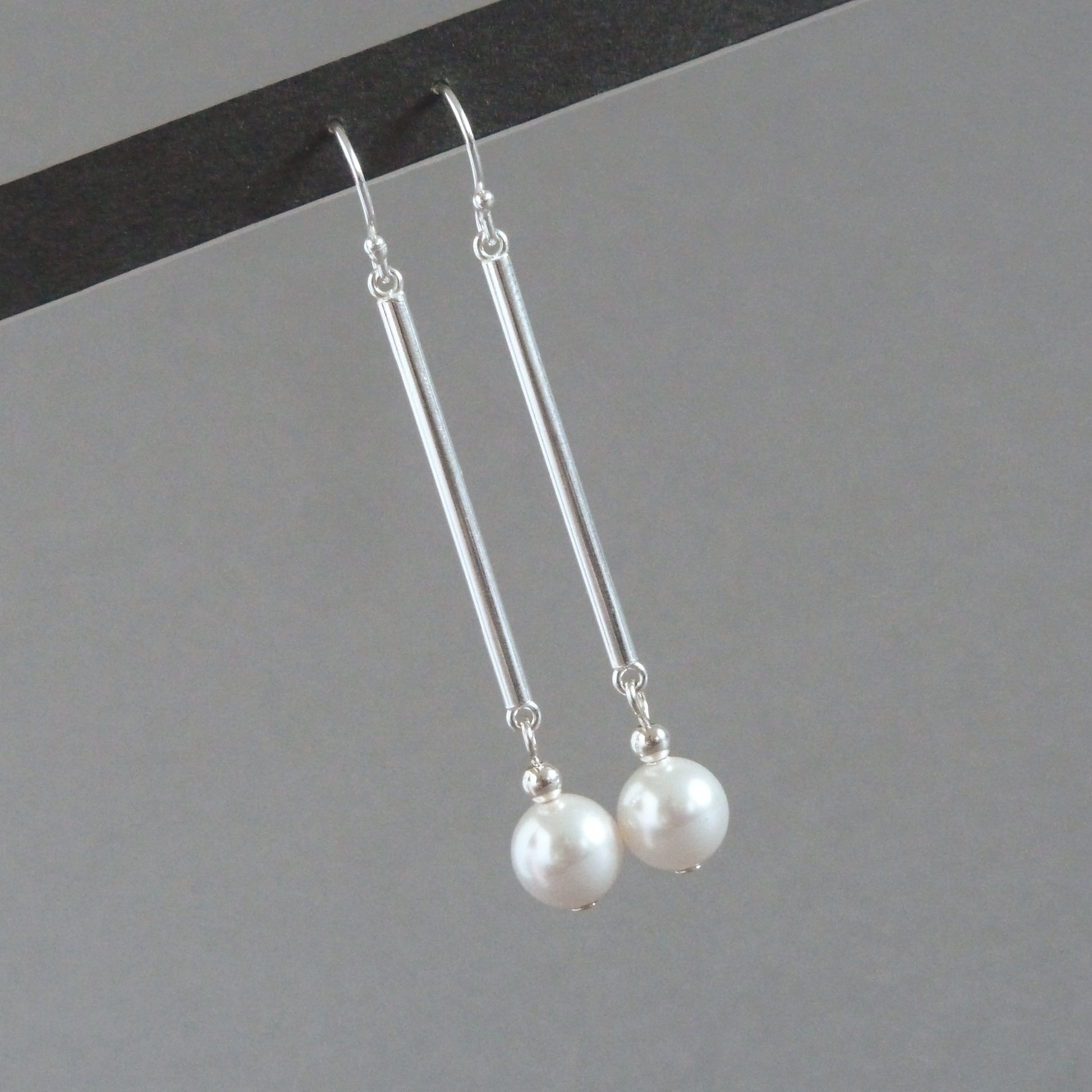 Long white pearl drop earrings