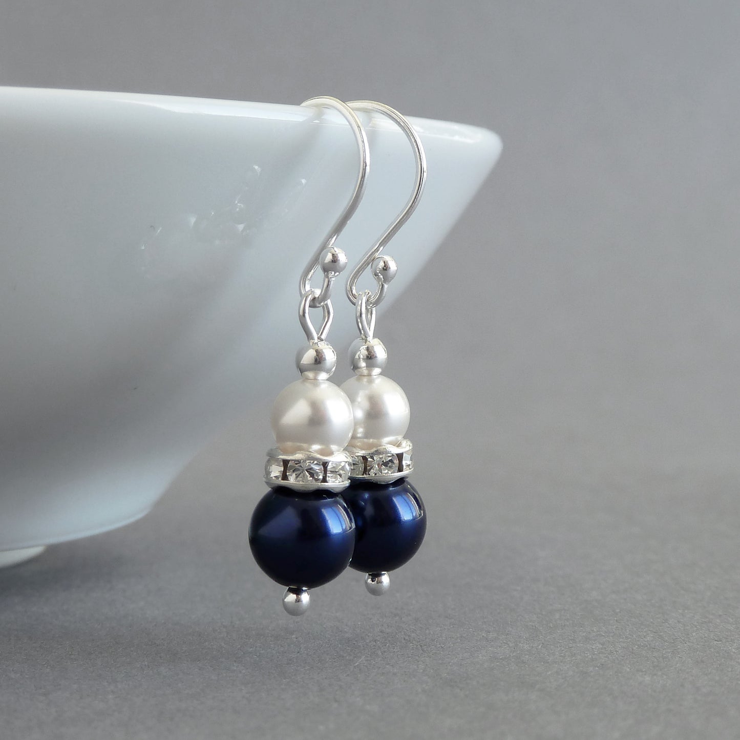 Navy blue pearl drop earrings with silver hooks