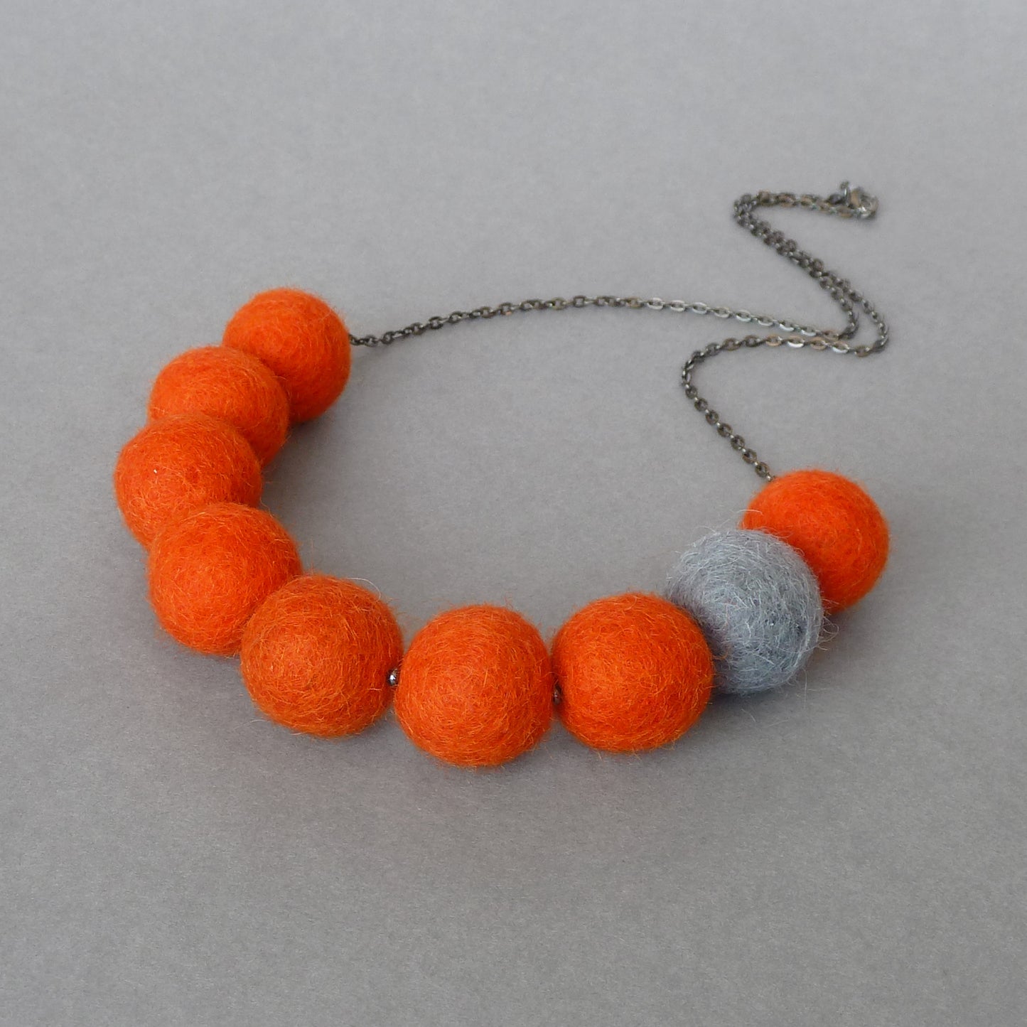 Orange and grey felt necklace