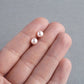 Pale pink pearl stud earrings