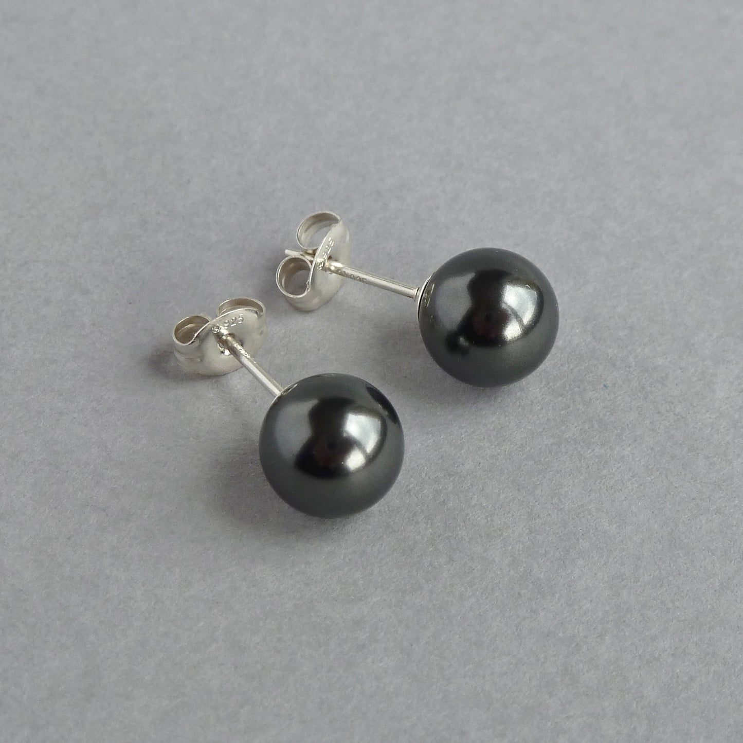 Round black pearl stud earrings