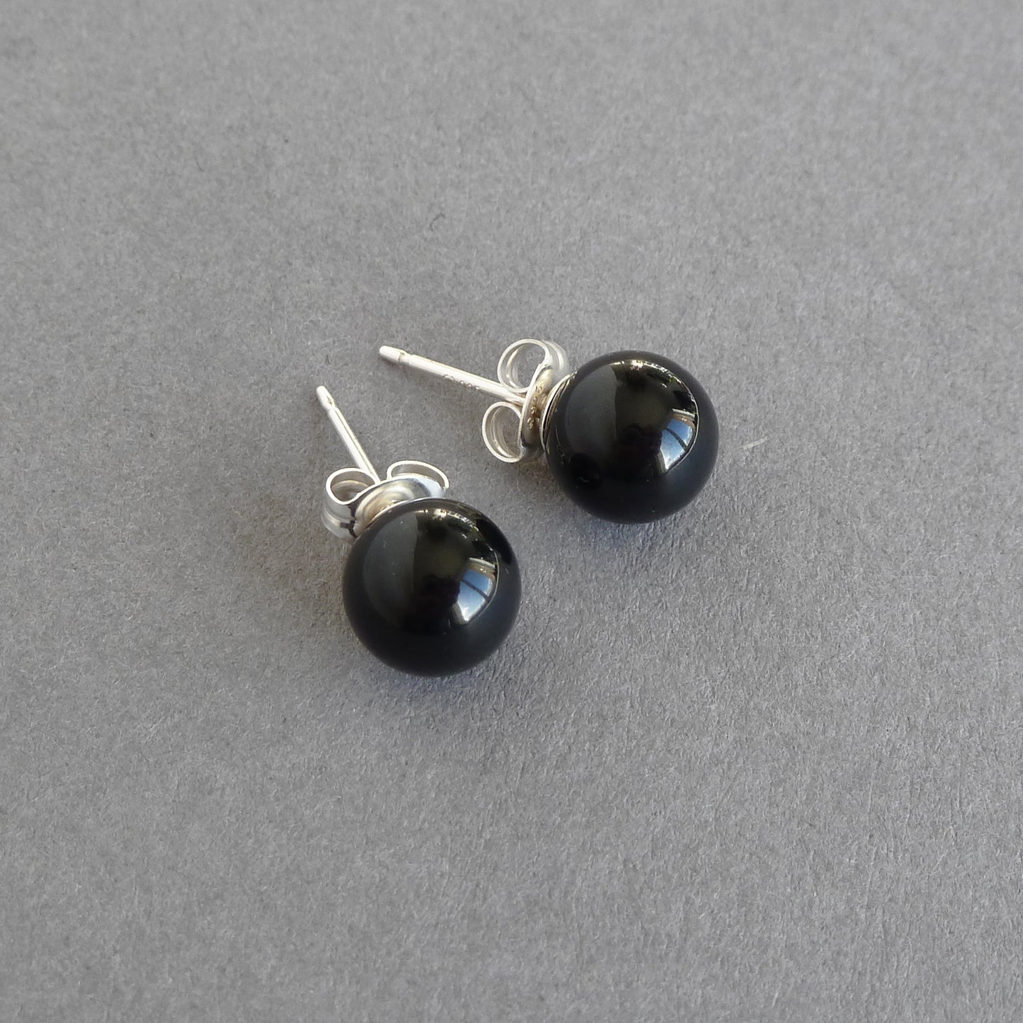 Round jet black stud earrings