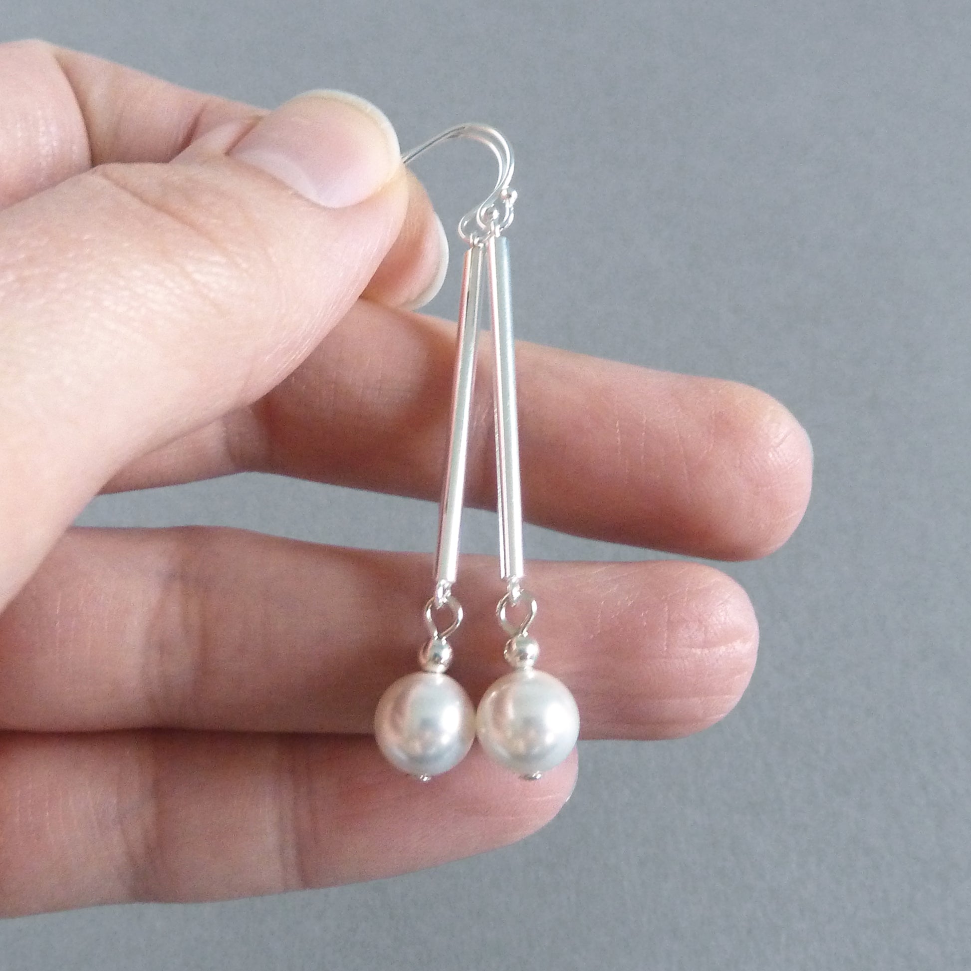 Silver and white pearl dangle earrings