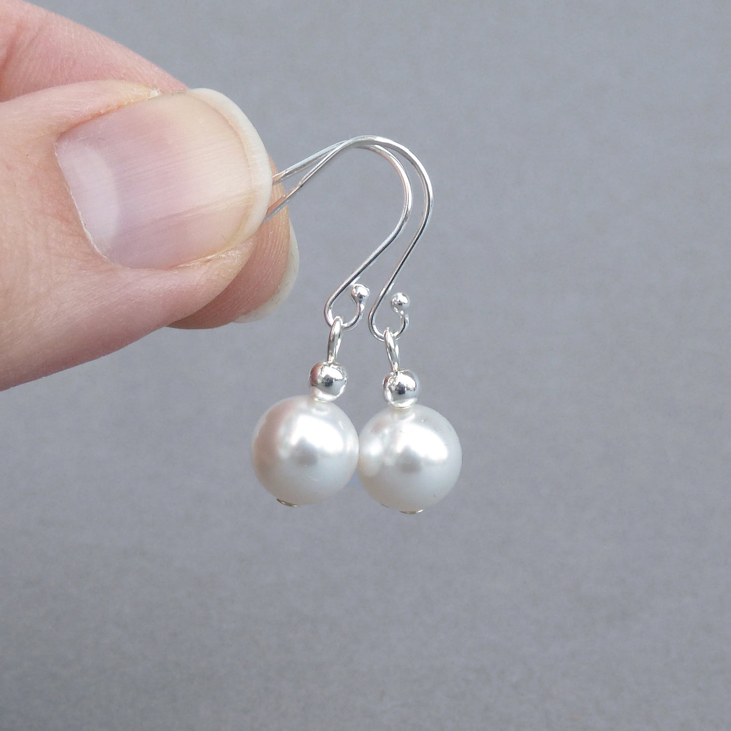 Simple dangly white pearl earrings