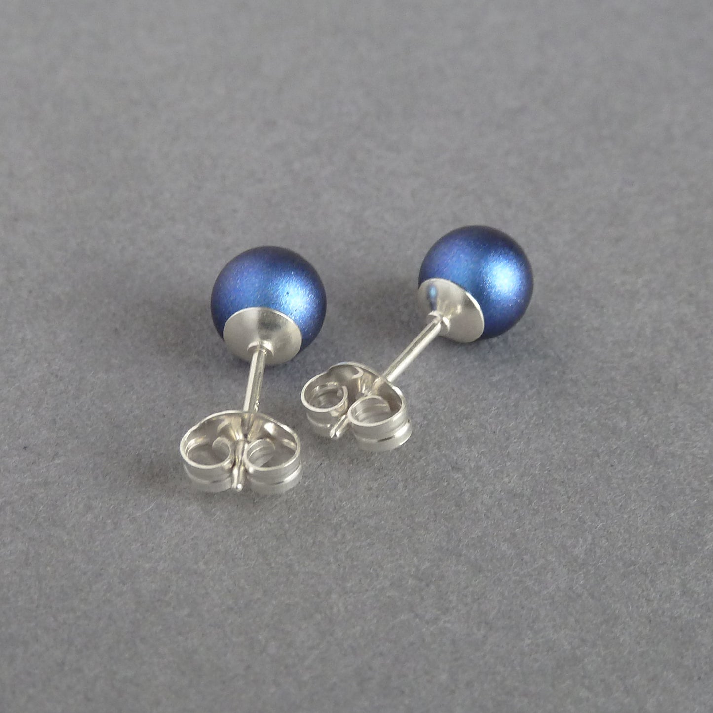 Small dark blue pearl studs